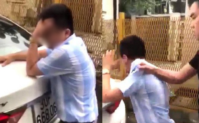 Anh Phạm T.A. bị nữ học viên cùng người đàn ông đánh chửi. Ảnh cắt từ clip