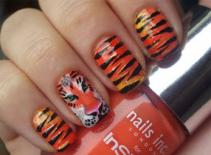 Vẽ nail con hổ tinh nghịch cho cô nàng cá tính