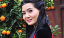 Triệu Trang diện áo dài kỉ lục 16m đón xuân