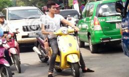 Vĩnh Thụy không đội mũ bảo hiểm vi vu trên đường