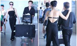 Lâm Chi Khanh lưng trần, khoác chặt vai bạn trai ở sân bay
