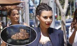 Kim ra phố với áo ren khoe bụng bầu