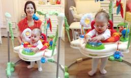 Con gái Vũ Thu Phương lững chững tập đi cạnh bà ngoại