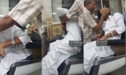 Thanh niên vui vẻ khi bị ông thợ cắt tóc... đánh