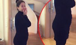 Thu Minh mặc áo bó sát khoe bụng đang lớn dần