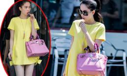 Ngọc Trinh khoác túi hơn 400 triệu hồn nhiên "mút kẹo" giữa phố