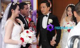 Tuấn Hưng nắm chặt tay cô dâu vượt qua đám đông để lên xe hoa