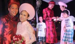 Cô dâu Khánh Linh và chú rể trao nhẫn cưới trước sự chứng kiến của hai con trai