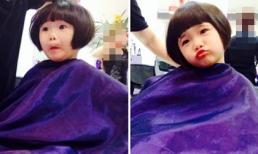 Con gái Thúy Nga ngồi cắt tóc vẫn say sưa tạo dáng