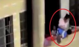 Bà mẹ treo con lủng lẳng trên tầng 7 gây phẫn nộ