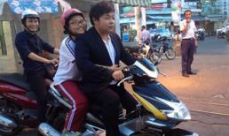Quang Lê bị 'ném đá' vì không đội mũ bảo hiểm chở con nuôi