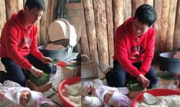 Chồng Phan Như Thảo đảm đang vừa gói bánh chưng vừa trông con