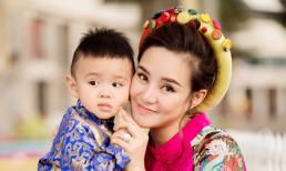 Vy Oanh diện áo dài rạng rỡ xuống phố cùng con trai