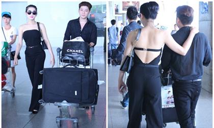 Lâm Chi Khanh lưng trần, khoác chặt vai bạn trai ở sân bay
