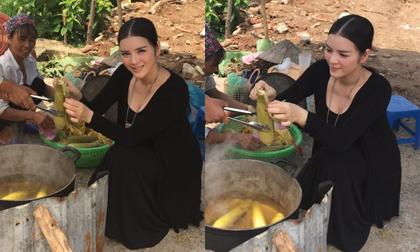  Lý Nhã Kỳ mặc đầm sang trọng 'lê la' ăn ngô rìa đường