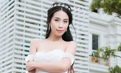 Người mẫu Lan Thanh diện váy cưới khoe vai trần e ấp