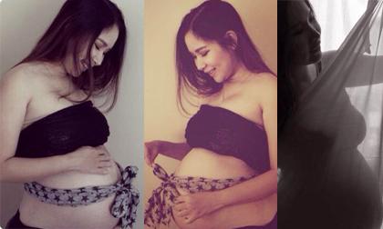 Duy Uyên vén áo khoe bụng bầu vượt mặt