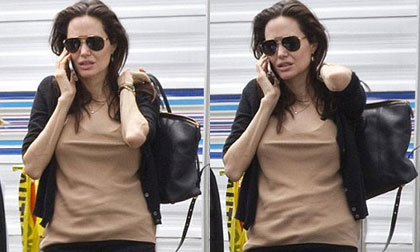 Angelina Jolie mệt mỏi đưa các con đi thăm Brad Pitt