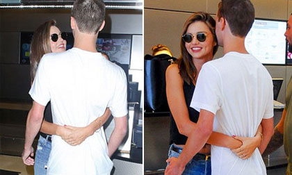 Miranda Kerr ôm chặt tỷ phú công nghệ ở sân bay