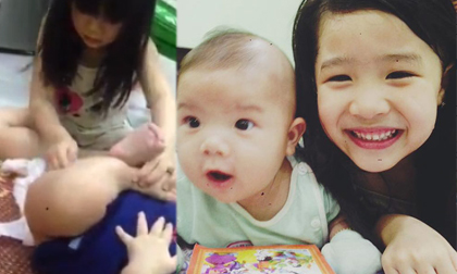 Chị gái 5 tuổi thay bỉm thành thạo cho em 3 tháng