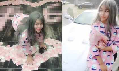 Cô gái ‘mặt rắn’ lai Việt ngồi giữa đống tiền gây chú ý