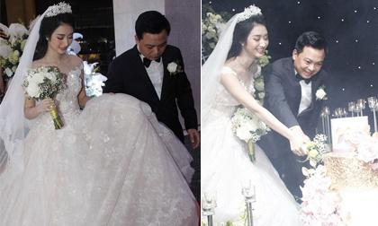 Đám cưới Hoa hậu Thu Ngân: Chồng đại gia cẩn thận nâng váy cho cô dâu