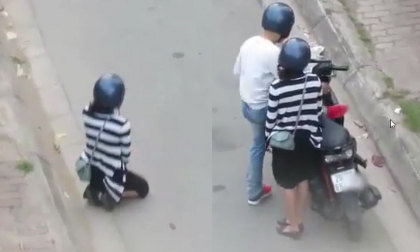 Clip: Cô gái quỳ gối xin lỗi bạn trai giữa đường Hà Nội