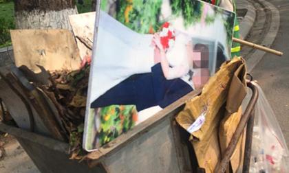 Đi làm về tôi giật mình khi nhìn thấy bức ảnh cưới của hai vợ chồng dựng cạnh thùng rác trước cổng