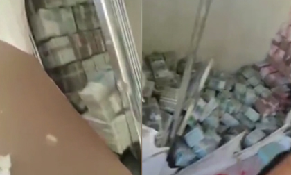 Mạng Trung Quốc dậy sóng vì video 'núi tiền' trị giá 225 tỷ đồng chất sau bức tường kín