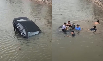 Người dân nhảy xuống sông đập cửa kính cứu tài xế say rượu mắc kẹt trong ô tô