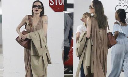 Đi mua sắm cùng hai con gái, Angelina Jolie diện váy xẻ ngực - khoét lưng quyến rũ