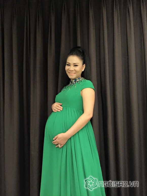 Thu minh,ca si thu minh,giam khao vietnam idol thu minh,thu minh khoe bung bau